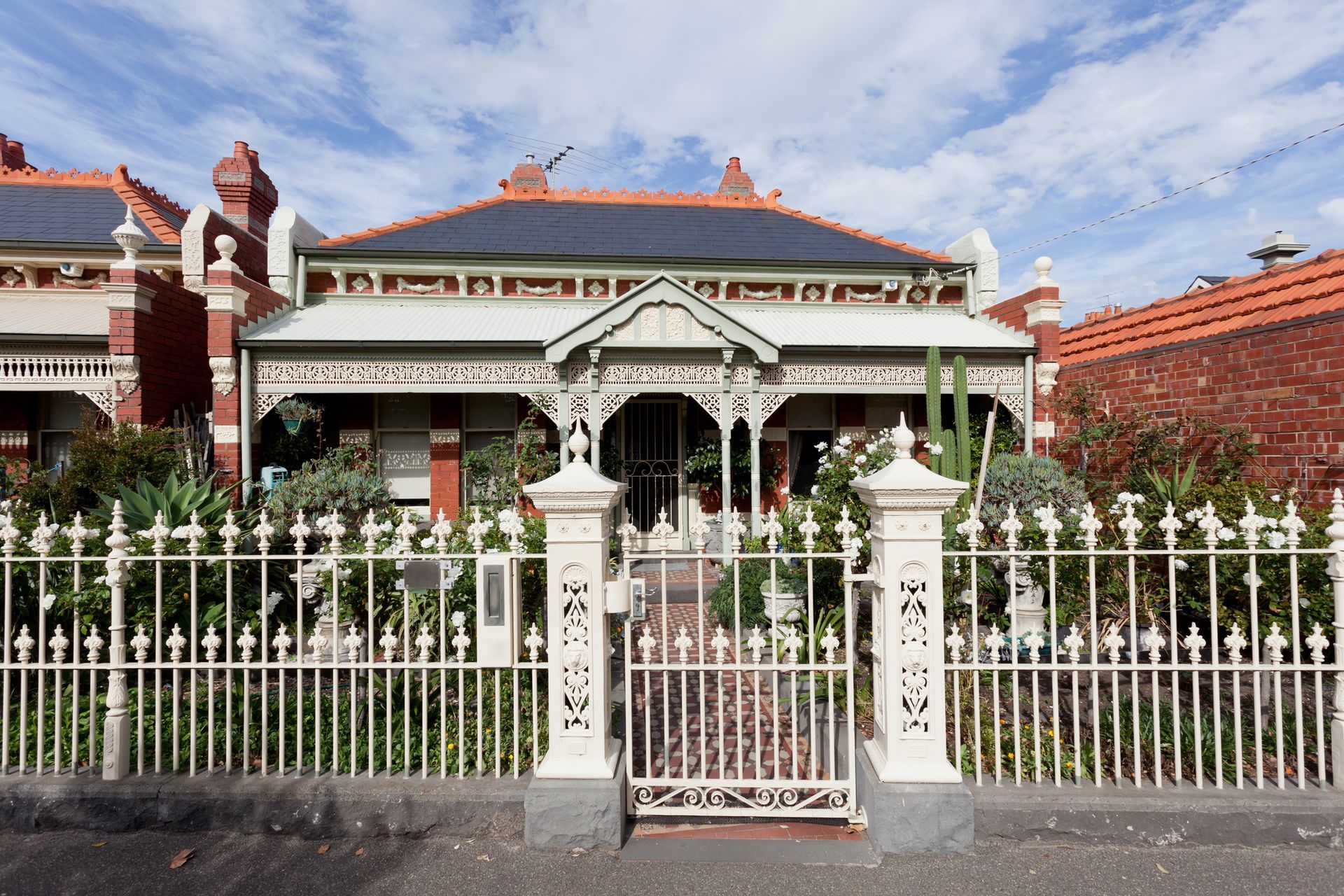 A house with a wrought iron fence around it
