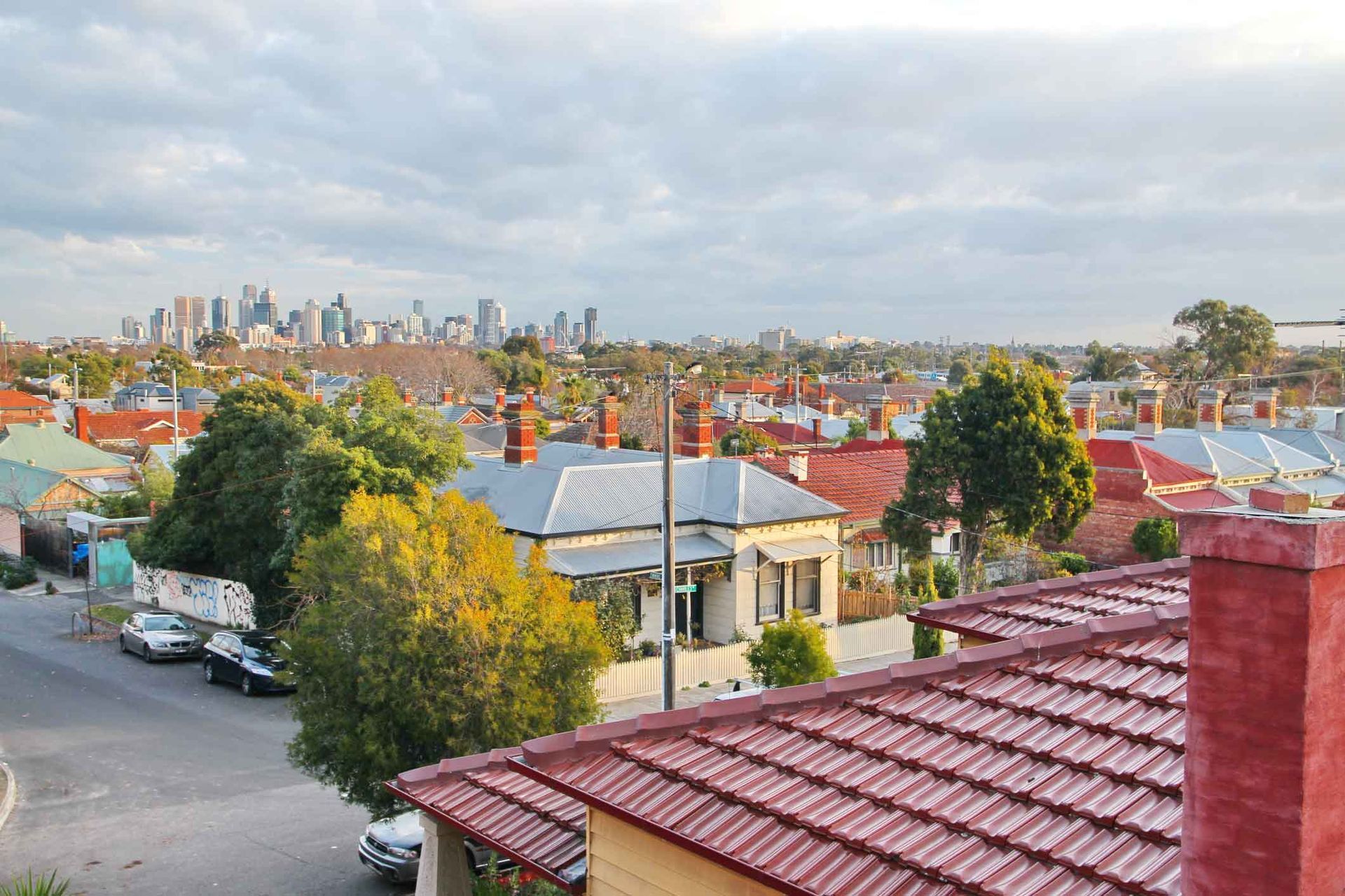 An aerial view of a city with a red tiled roof
