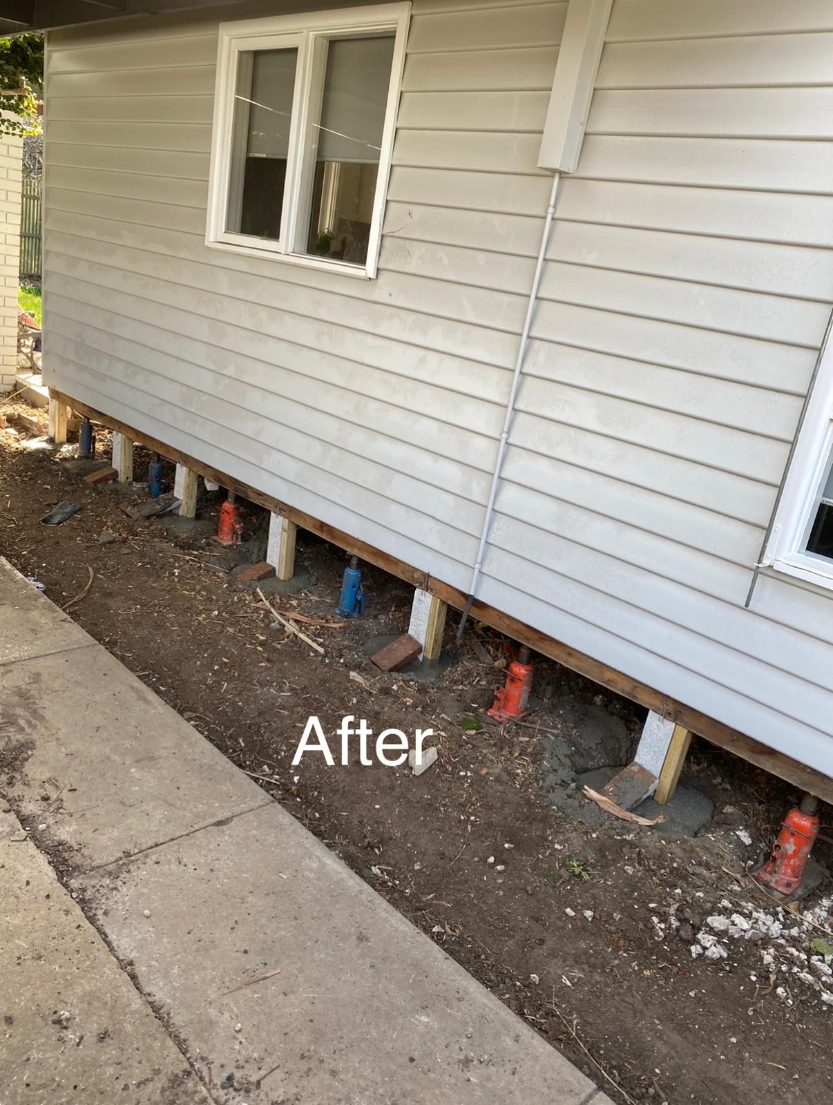 A picture of a house being built on stilts.