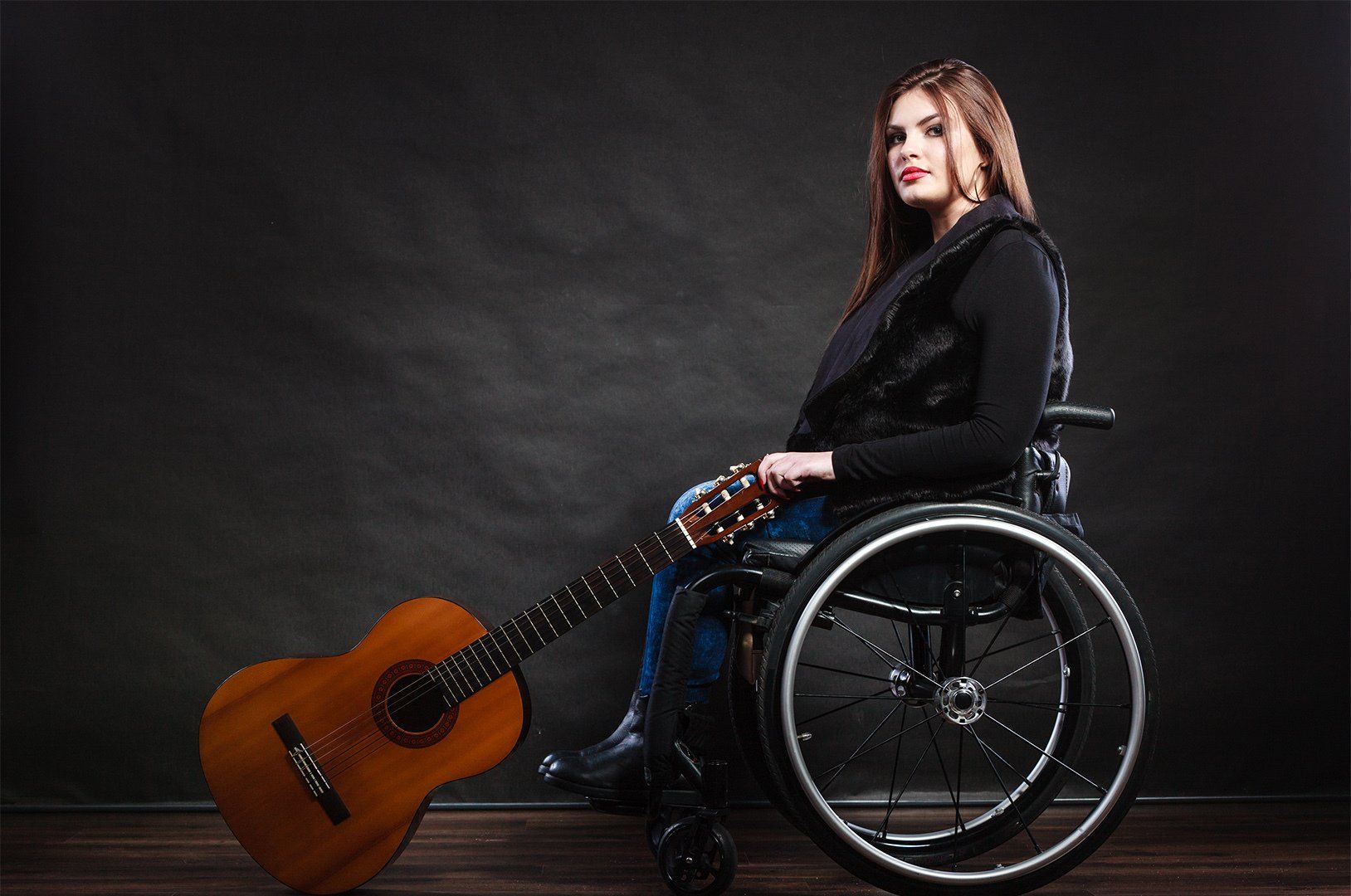 girl in wheelchair with guitar