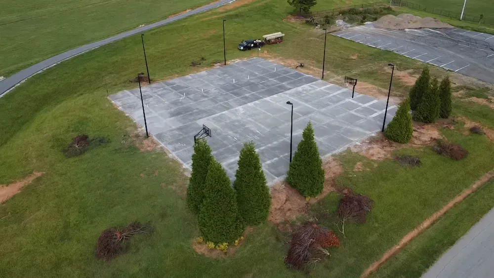 An aerial view of a basketball court in a park.