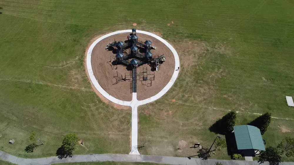 An aerial view of a playground in a park.