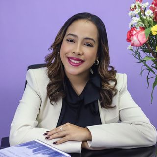 Sofia Hernandez PTY Lawyers 
(a woman in a white jacket sits at a desk with flowers in the background)