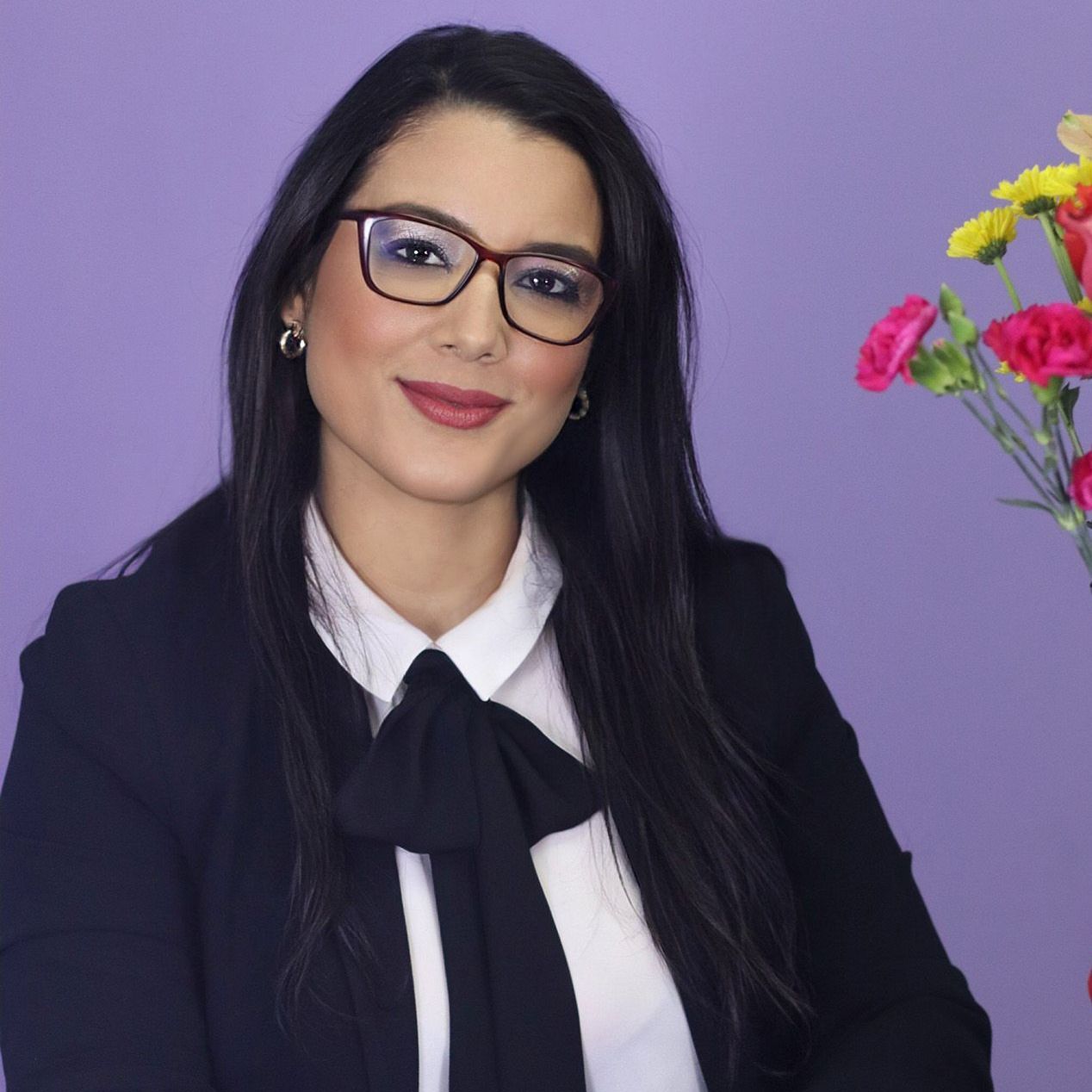 Kathyel Ferguson PTY Lawyers
(a woman wearing glasses and a bow tie stands in front of flowers)