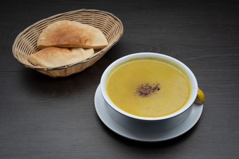 Lentil Soup A bowl of Lentil Soup next to a basket of pita bread