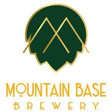 The mountain base brewery logo is a green and gold logo with a mountain and a hop.