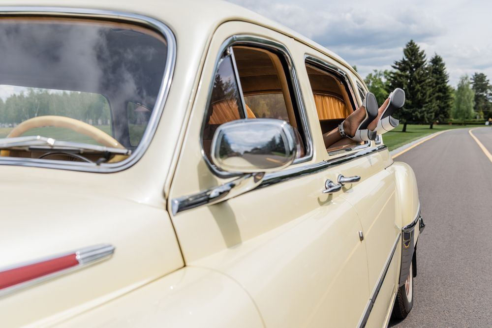 Bride In White Vintage Car — Classic Car Hire in Dundowran Beach, QLD