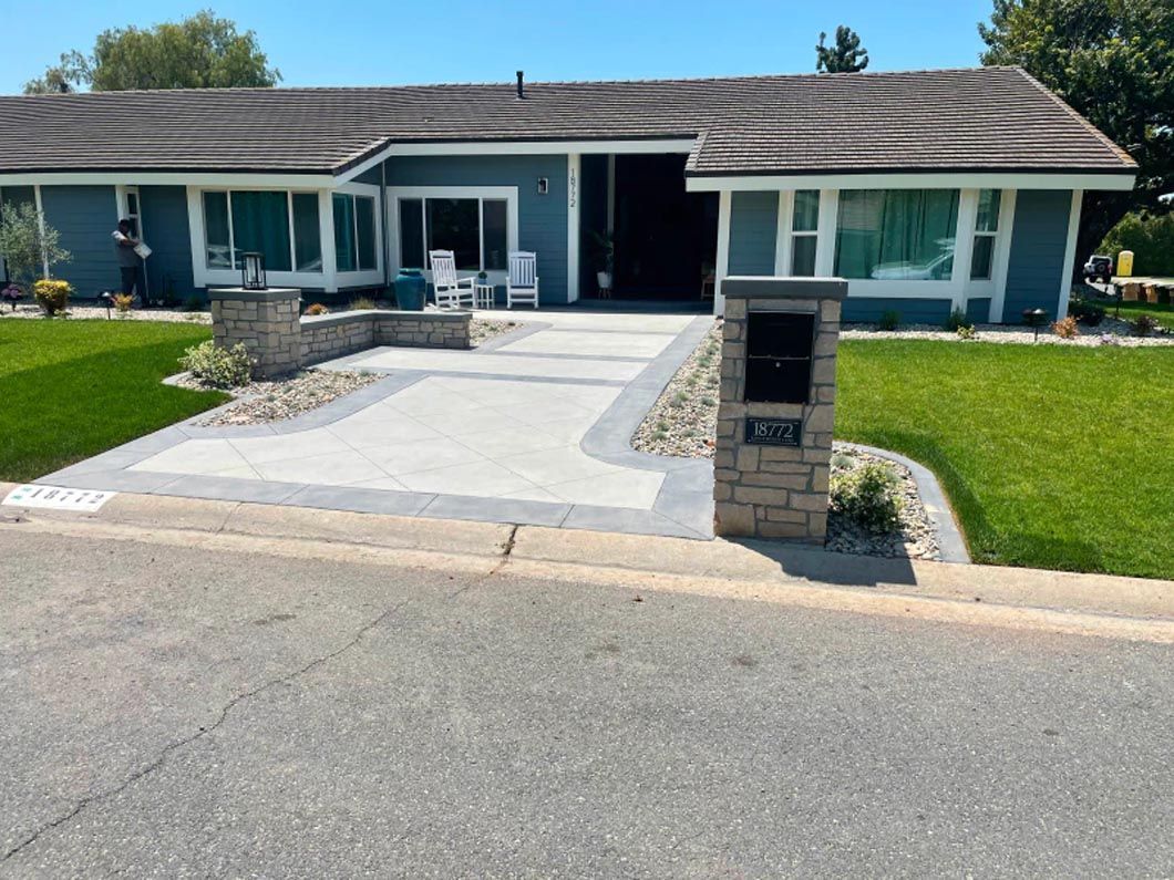 A blue house with a mailbox in front of it