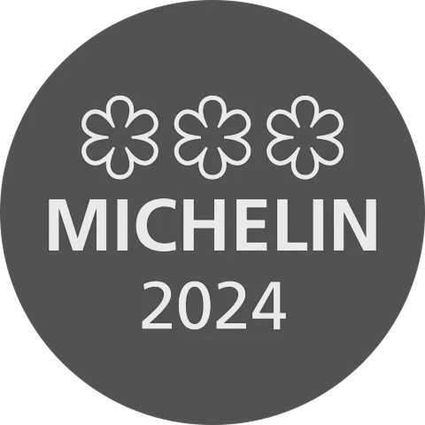 Michelin Guide 2024: Gray circle with three flower-like Michelin stars above 