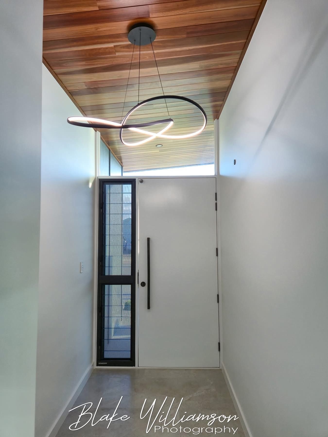 Electrician Using a Screwdriver on a Circuit Breaker Panel With Colorful Wires — Quaite Electrical Pty Ltd In Bundaberg, QLD