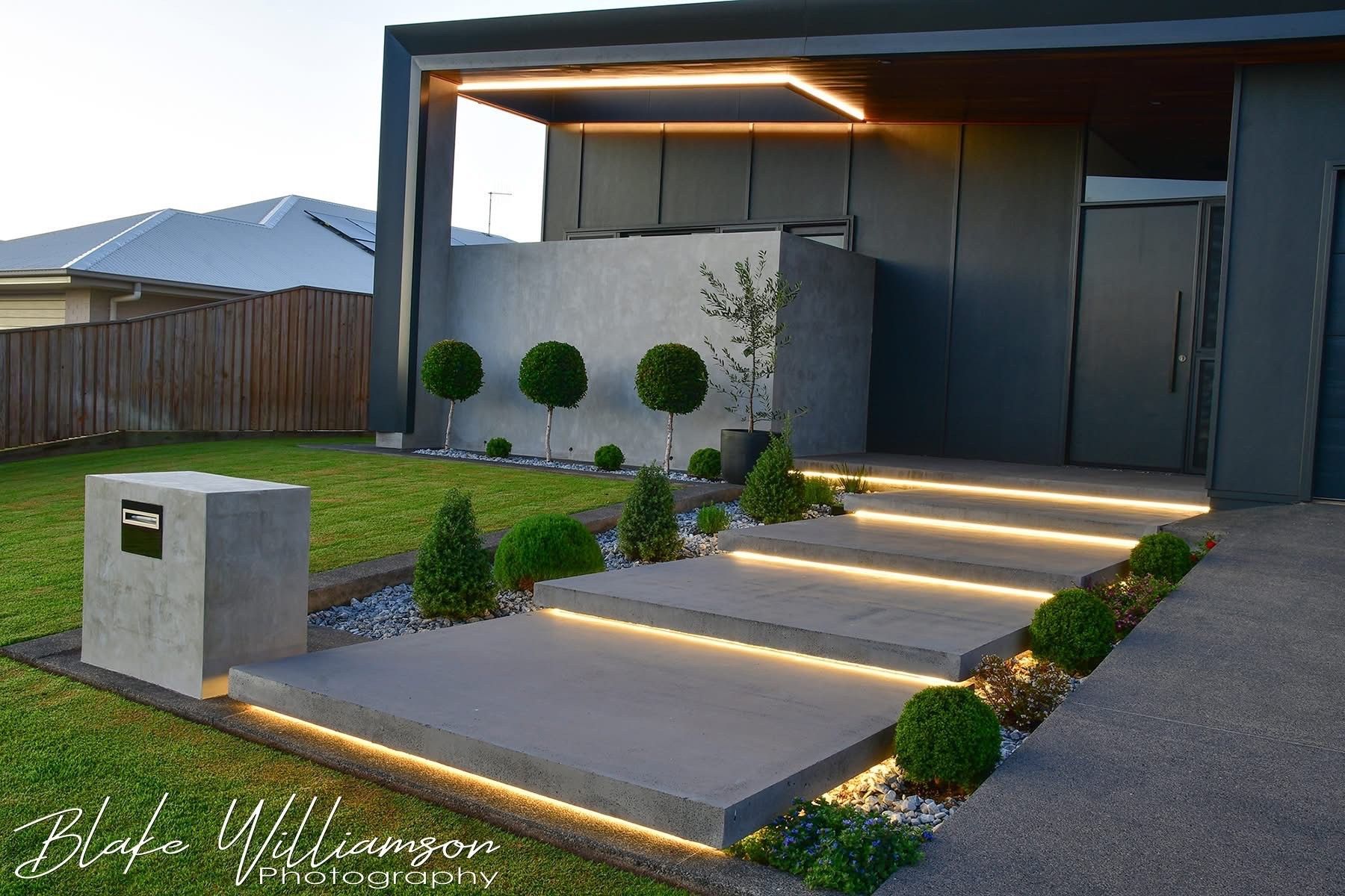 Electrician Testing Wires in a Wall Outlet, Wearing a Tool Belt — Quaite Electrical Pty Ltd In Bundaberg, QLD