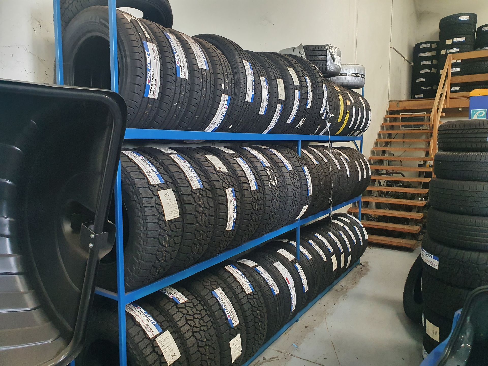A Blue Truck With A Black Tire Is Parked In A Garage — Suncoast Mechanical In Nambour, QLD