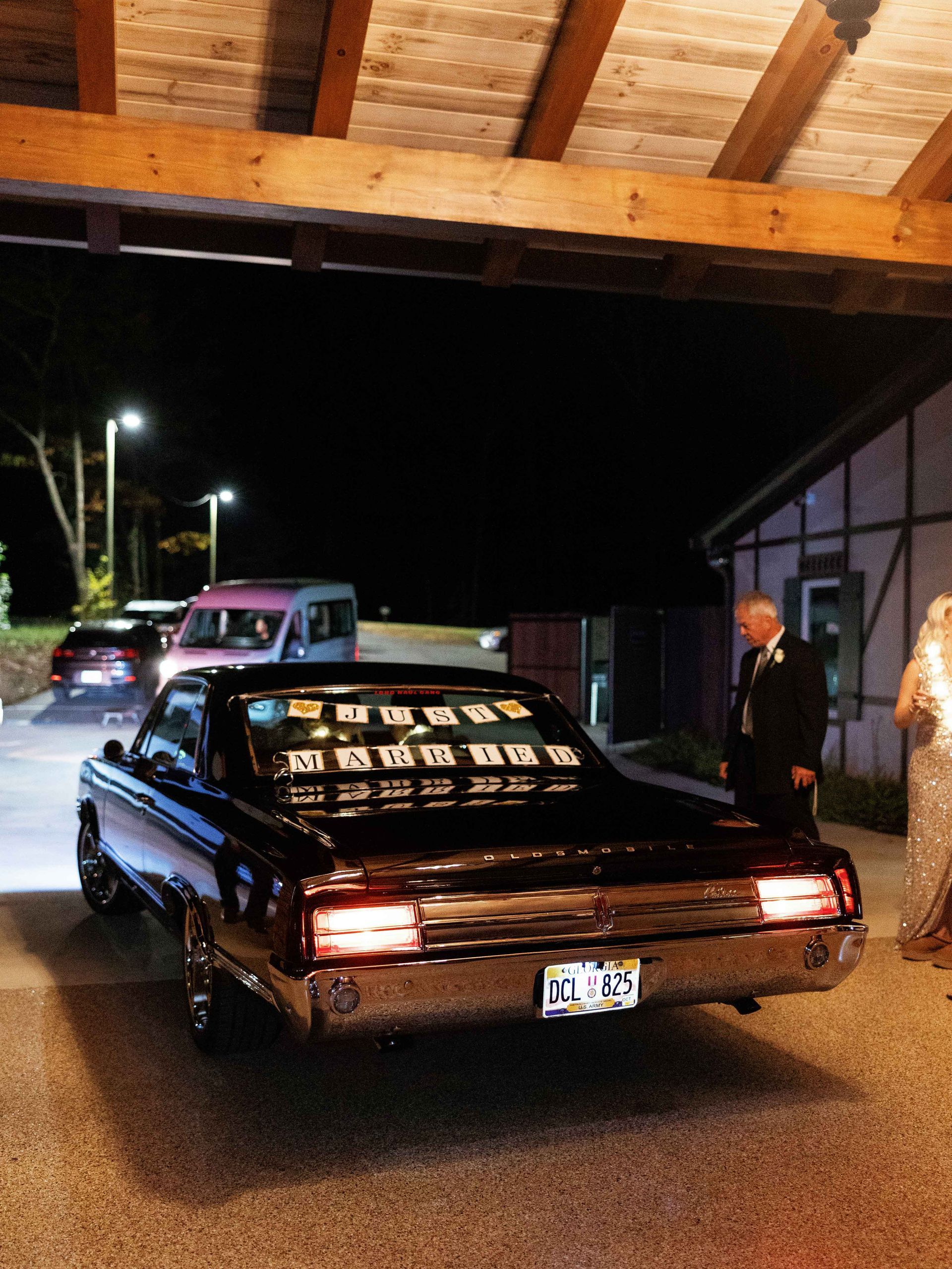 A black car with a license plate that says tl 88