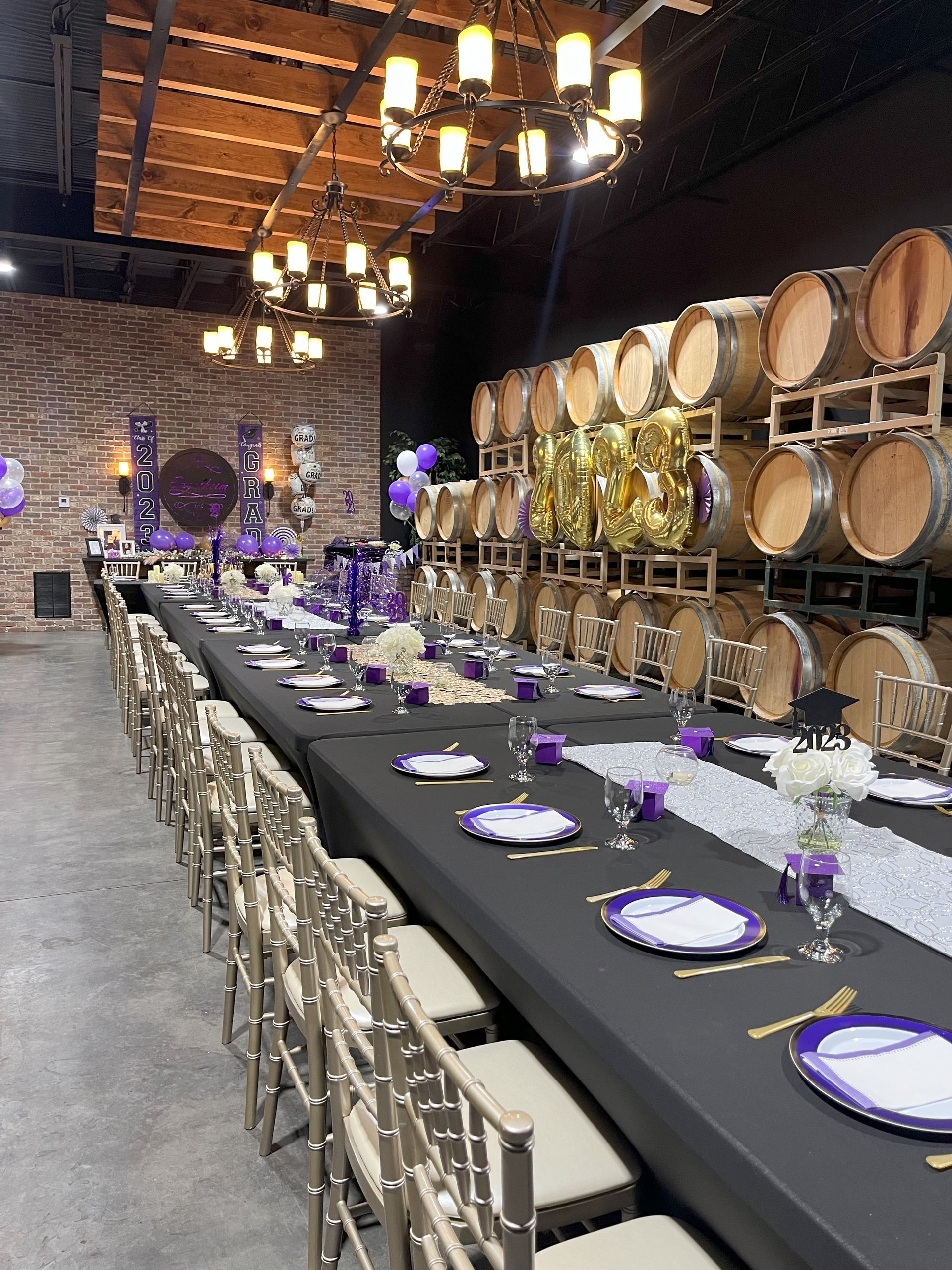 A long table with plates and glasses on it