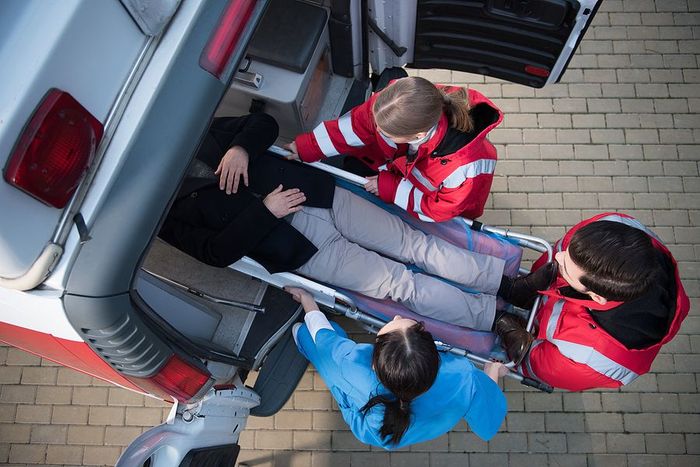 a group of people sitting in the back of a car