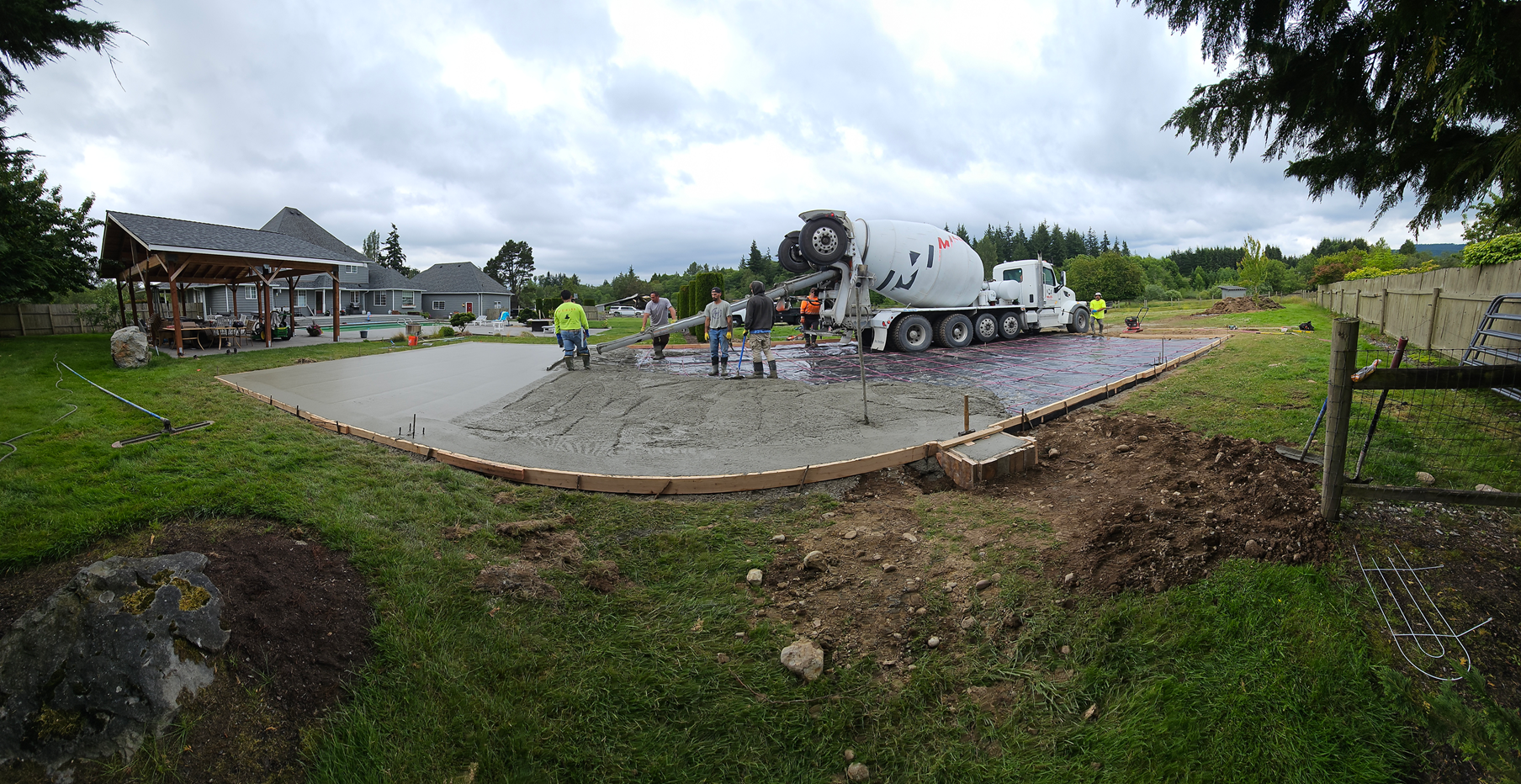 A man is standing on the side of a road.