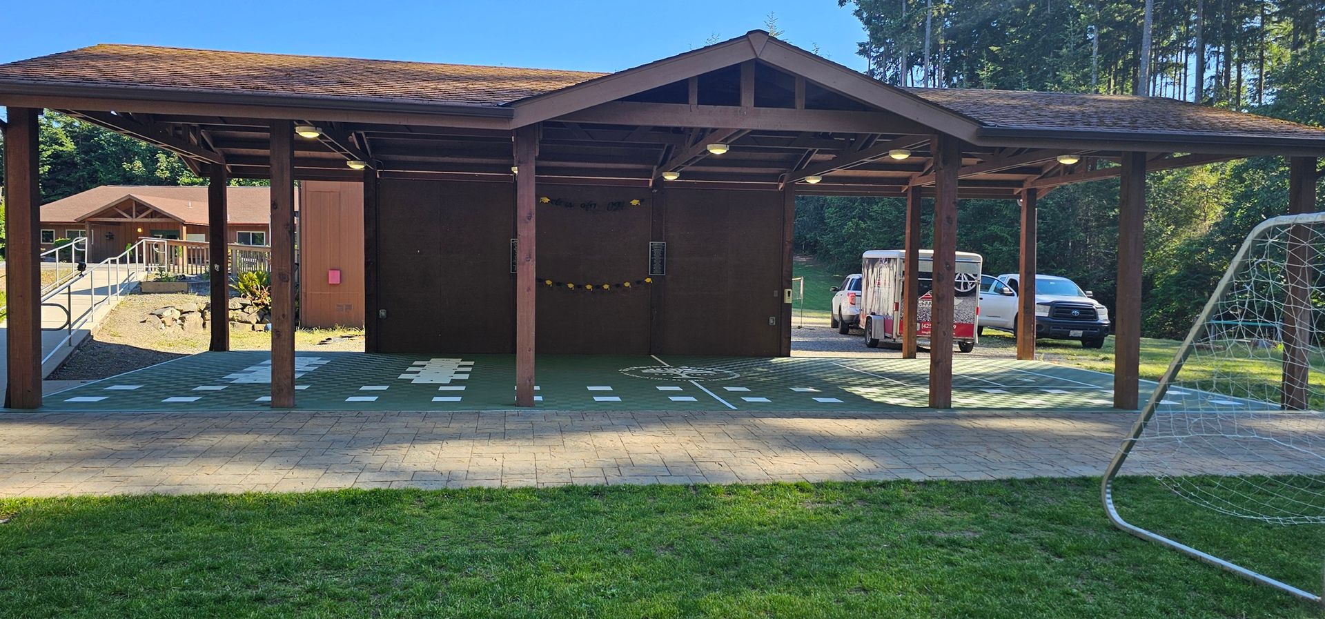 A man is standing on the side of a road.
