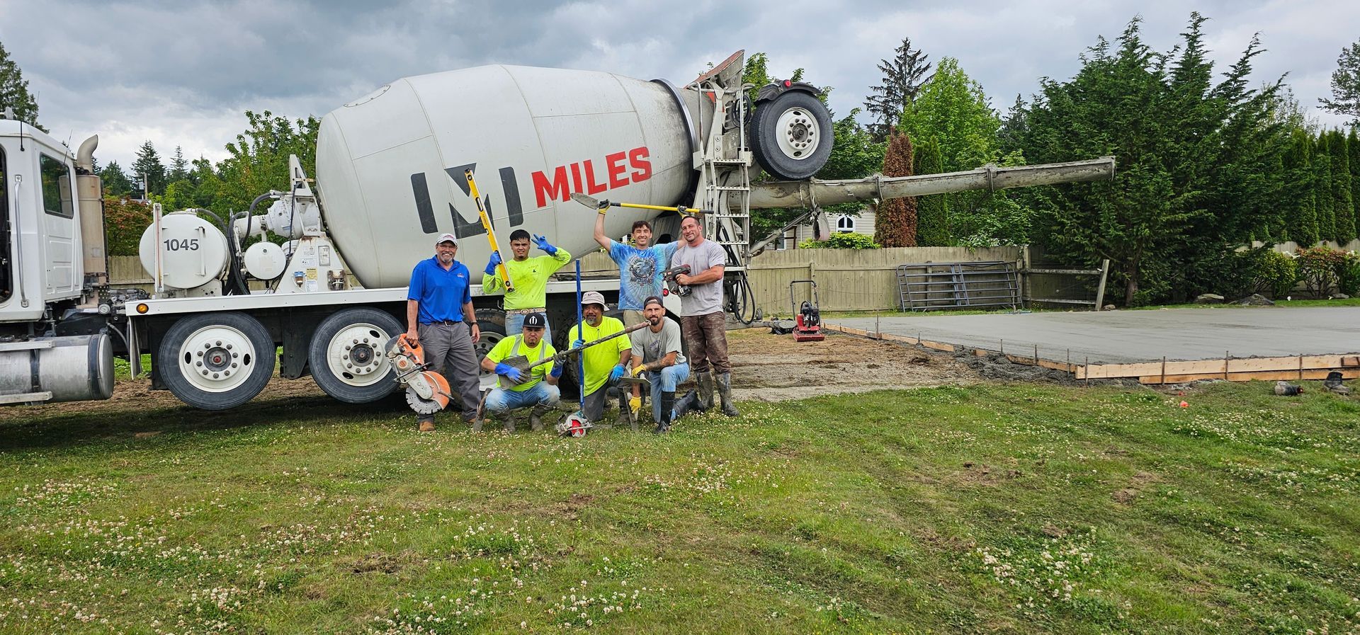 A man is standing on the side of a road.