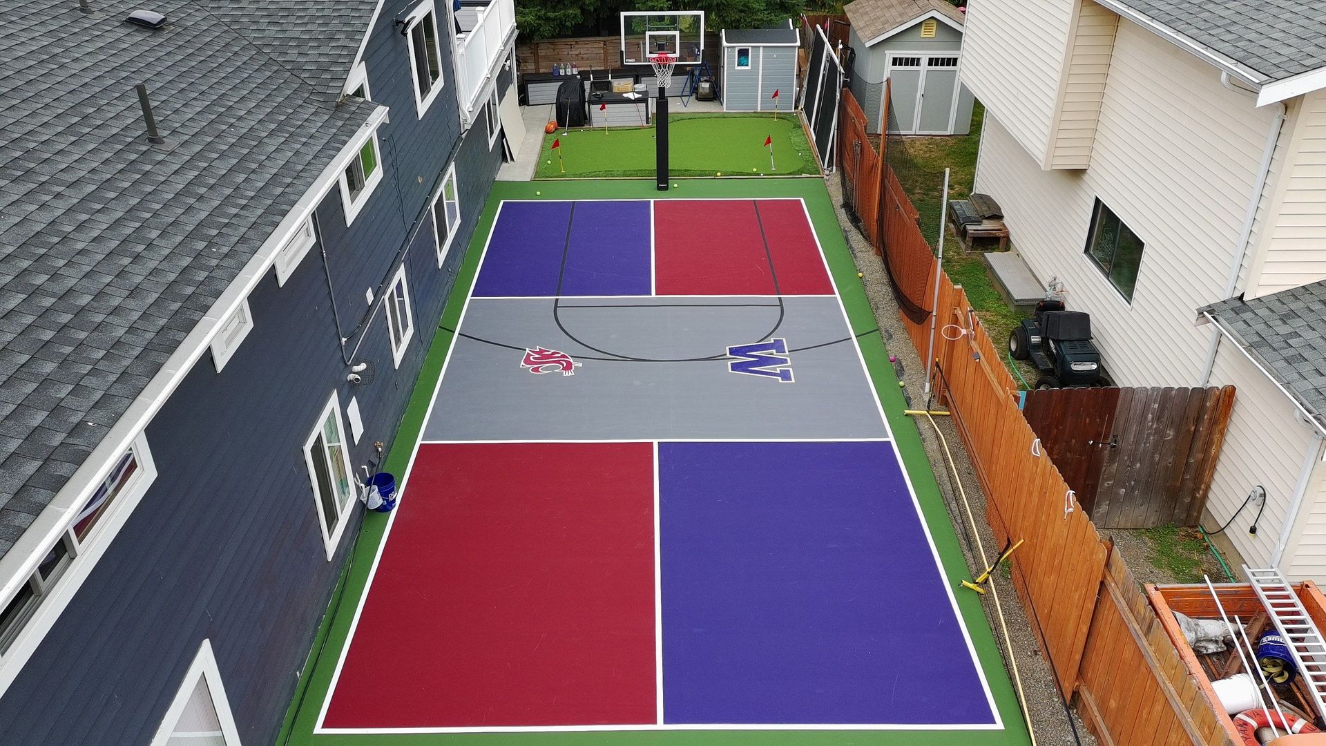 A man is standing on the side of a road.