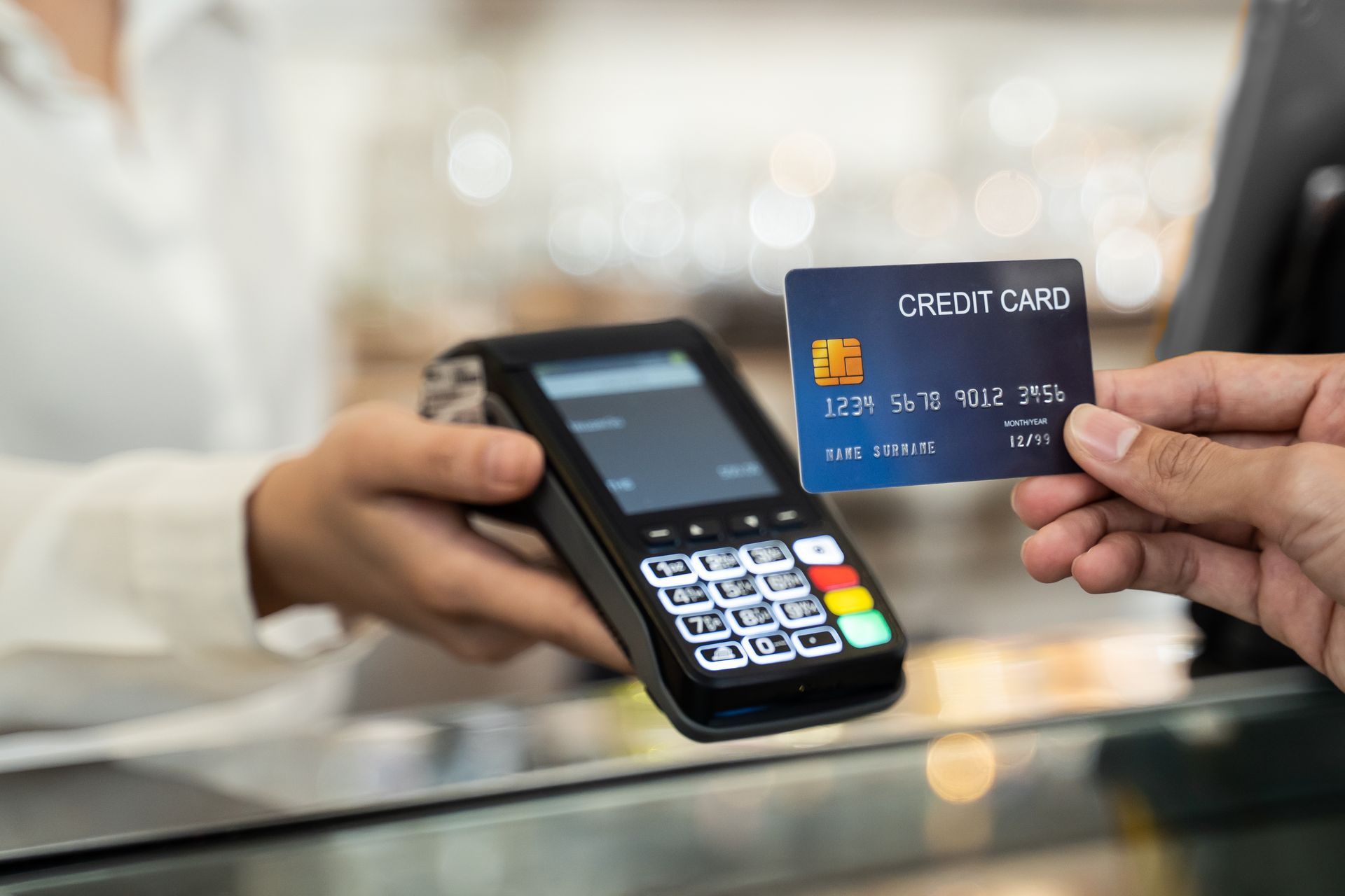 A person is paying with a credit card