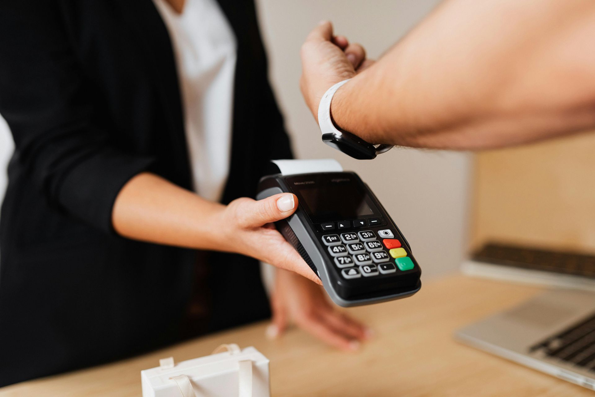 A person is using a credit card to pay for something