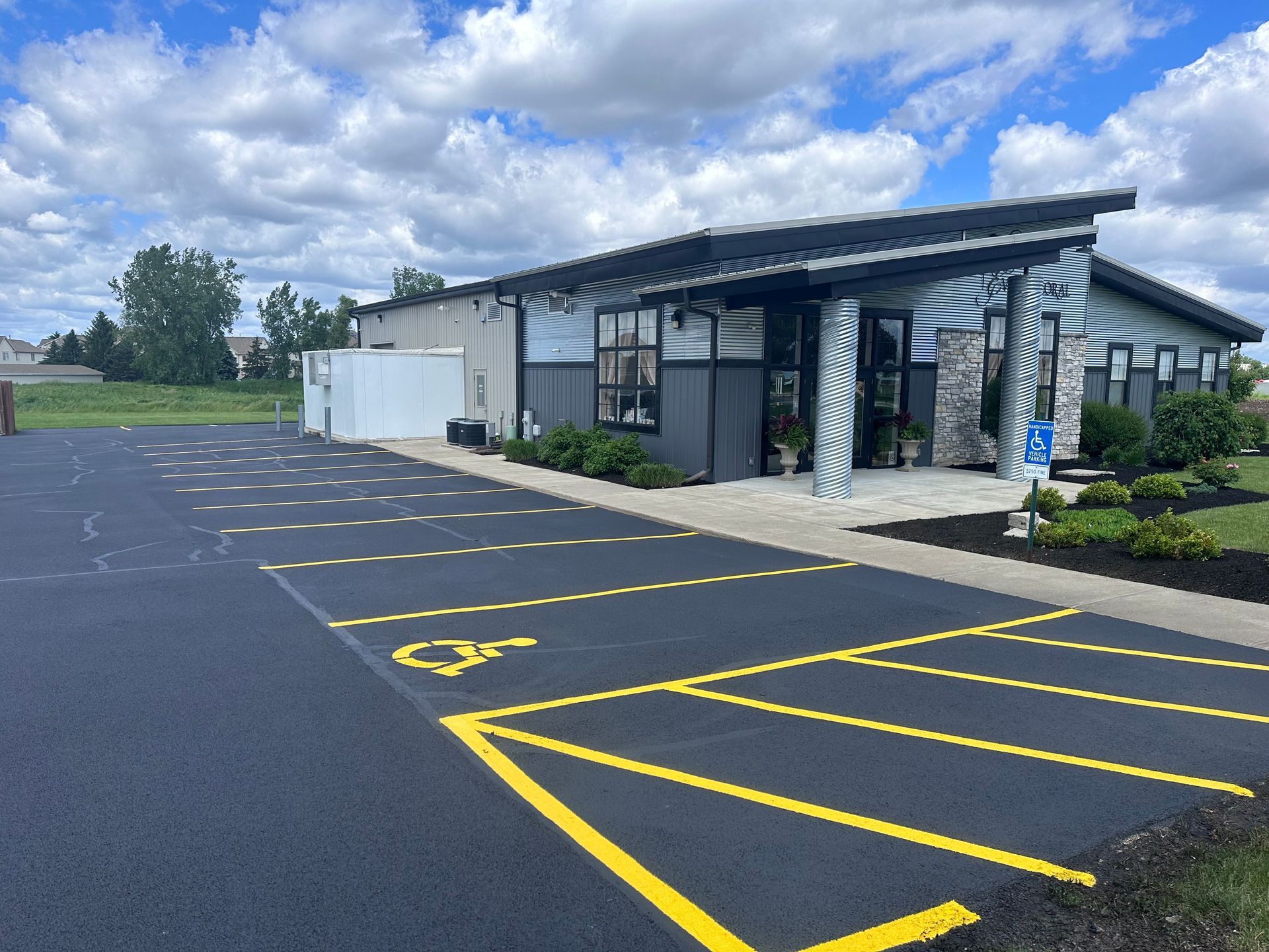 A Roller Is Rolling Asphalt On A Road - Capron, IL - Majestic Asphalt & Snow Services