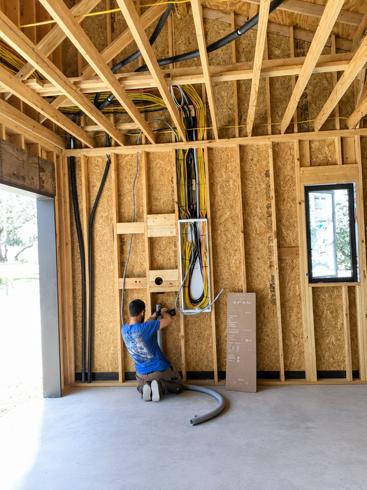 Electrician inspecting a residential panel