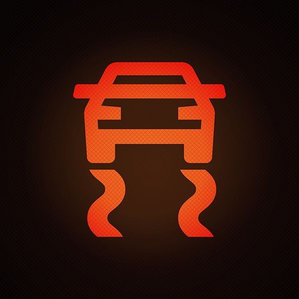 Red car symbol with squiggly lines underneath, indicating traction control system is active. | Morin Brothers Automotive