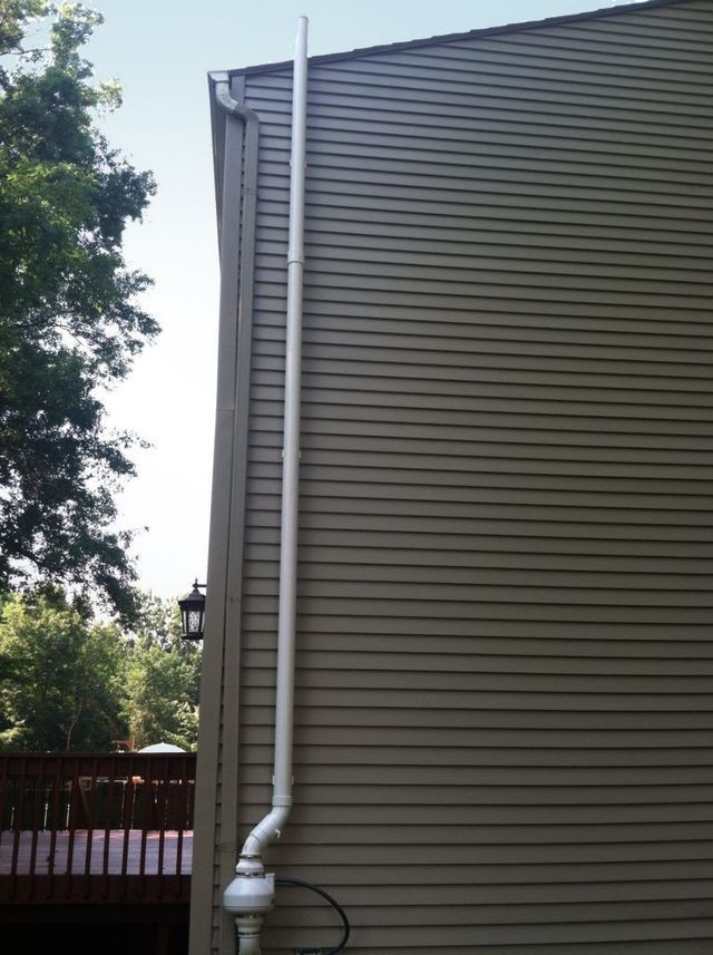 Pipe Installation at the Siding of a House - Youngstown, OH - Radon Raiders