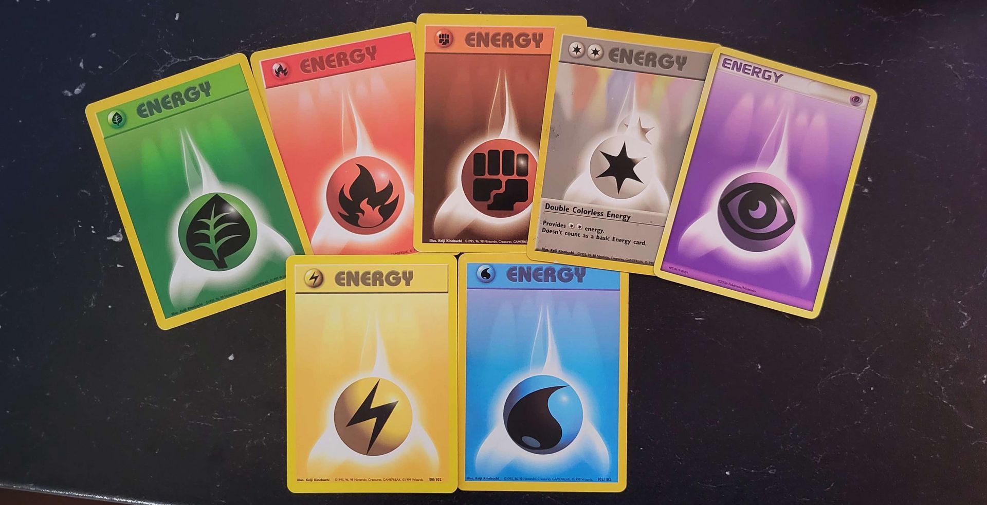 a bunch of energy cards are sitting on a table