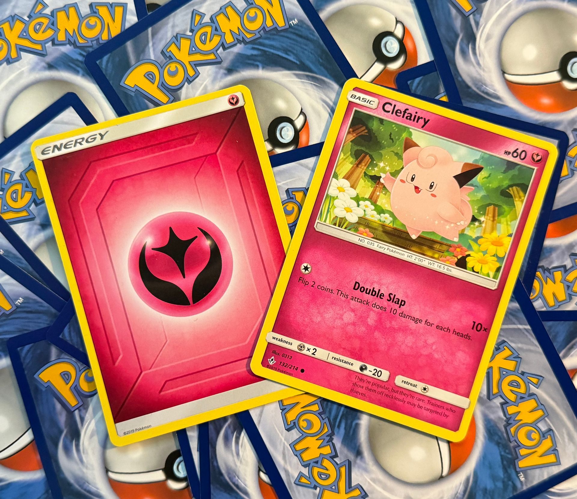 A Fairy-type Pokémon beside a Fairy Energy card.