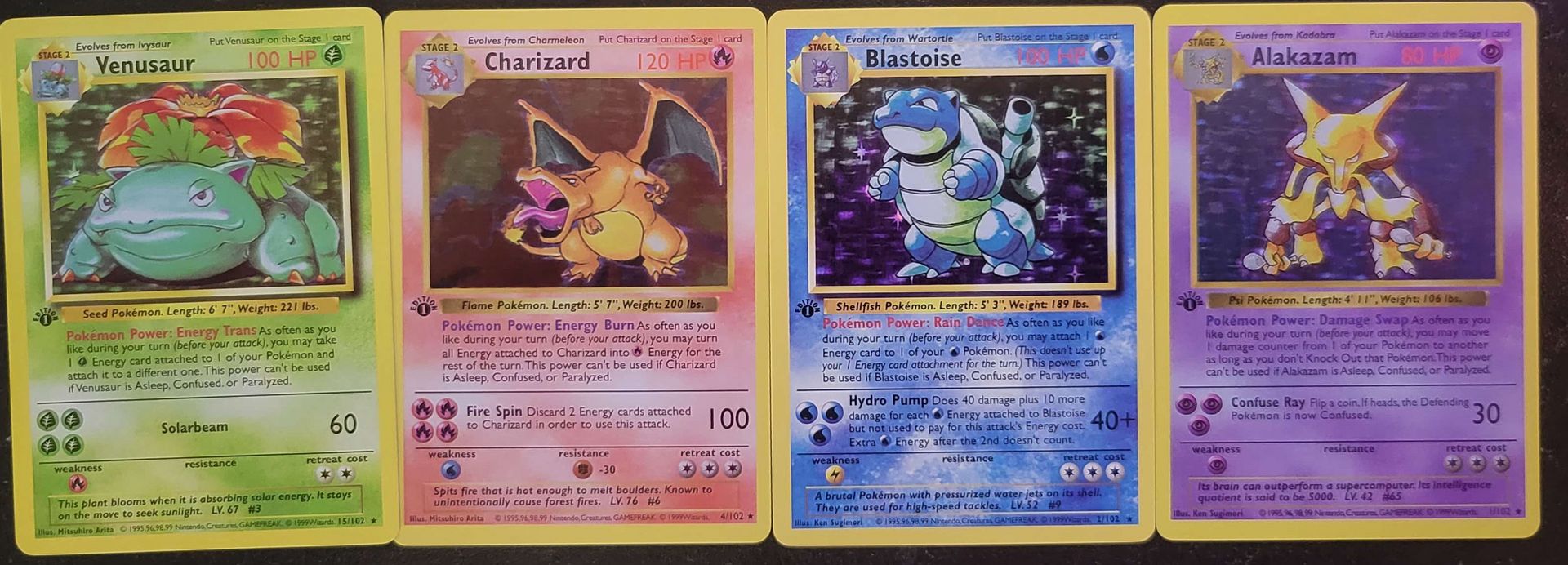 a bunch of 1st edition fake pokemon cards sitting next to each other