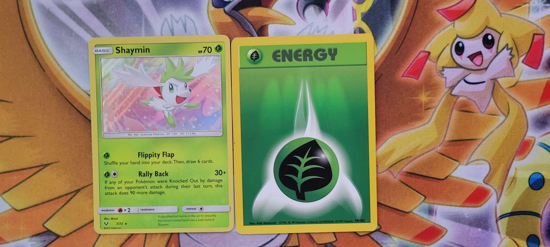 A Grass-type Pokémon beside a Grass Energy card.