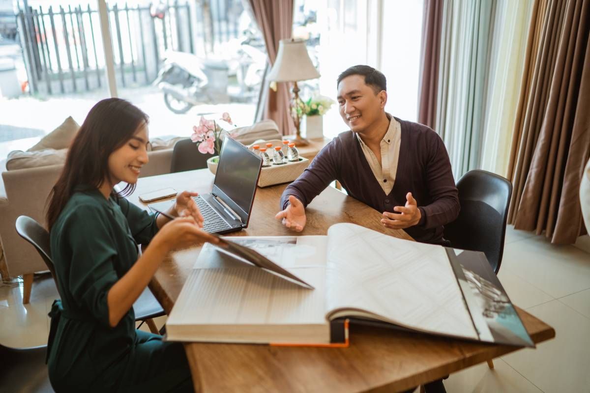 Window treatment professional helping with a consultation at NH Blinds near Manchester, NH