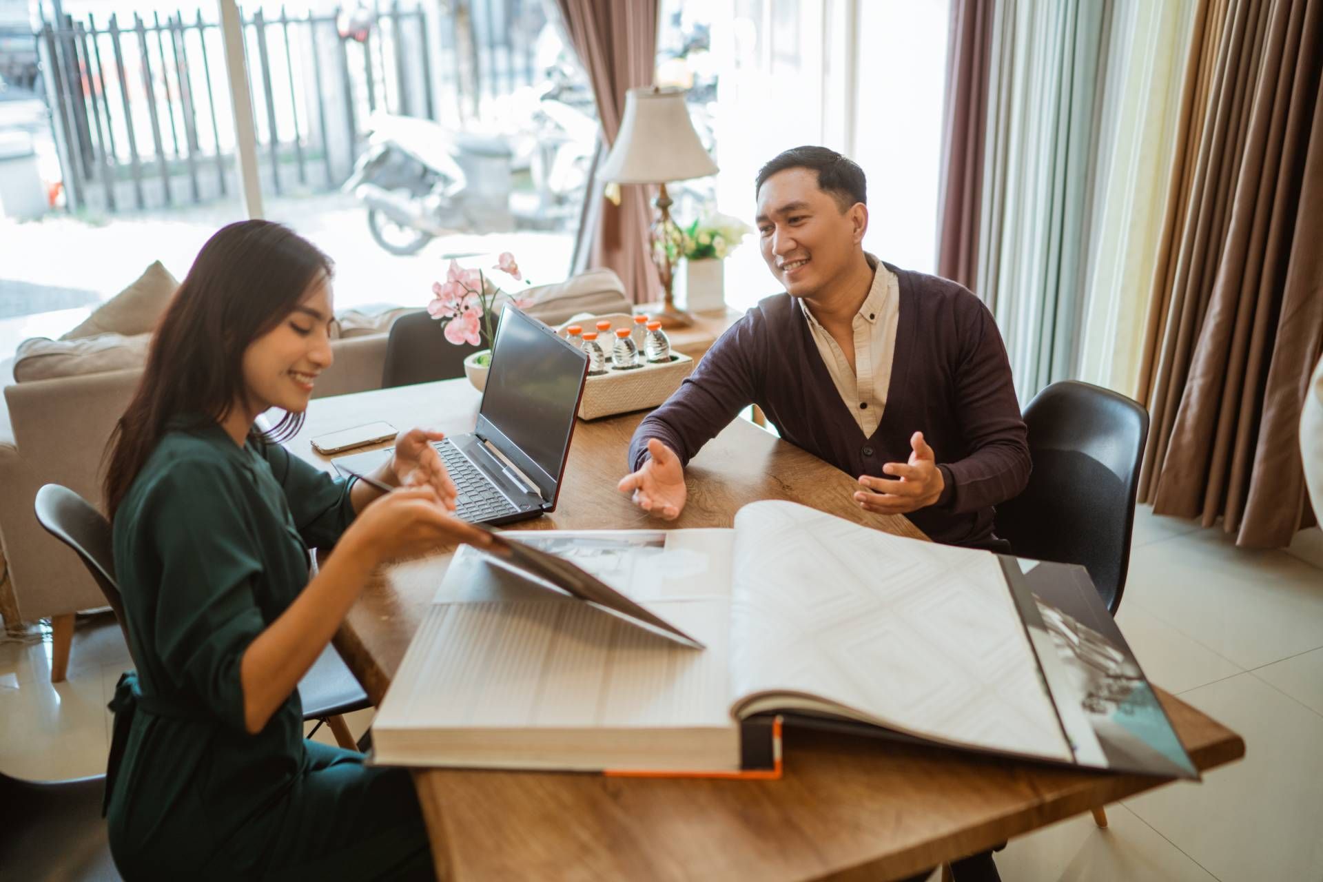 Window treatment professional helping with a consultation at NH Blinds near Manchester, NH