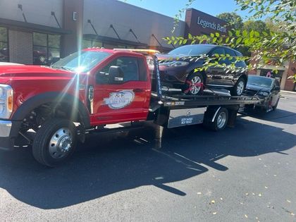 Professional tow truck providing towing services.