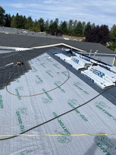 A roof is being installed on a house.