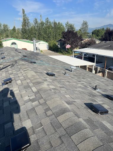 The roof of a house with a lot of shingles on it.