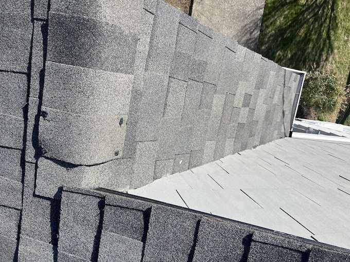 A close up of a roof with shingles on it