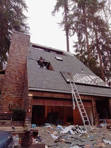 A house with a ladder on the side of it
