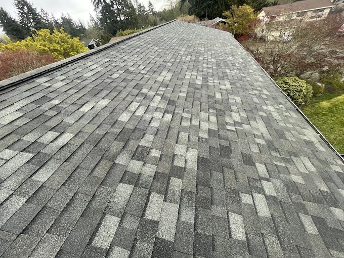 A close up of a roof with shingles on it.
