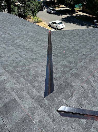 A car is parked on the roof of a house.