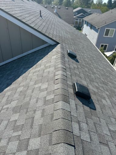 A close up of a roof with a roof vent on it.