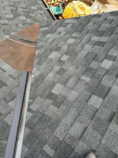 A close up of a roof with shingles on it.