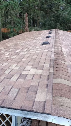 A close up of a roof with shingles on it.