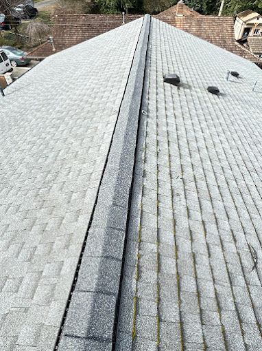 A close up of a roof with shingles on it.