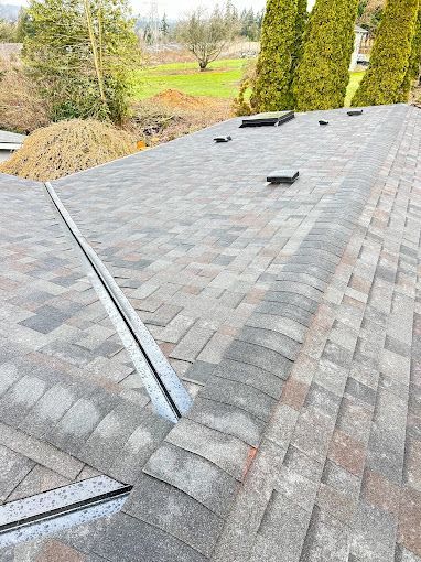 A close up of a roof with shingles on it.