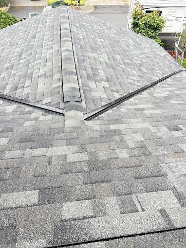 A close up of a roof with shingles on it.