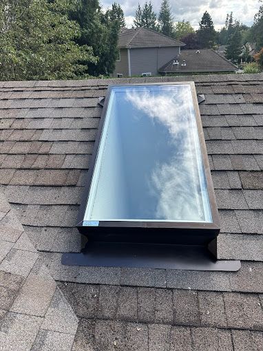 A skylight is on the roof of a house.