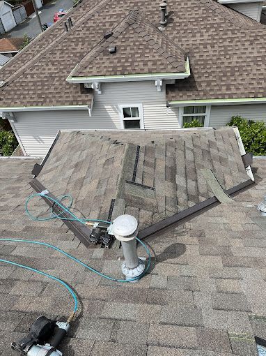 An aerial view of a roof with a hose attached to it.